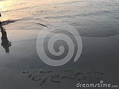 Shadow of man wears standing in the sea with â€œfarewell year 2017â€ concept Stock Photo